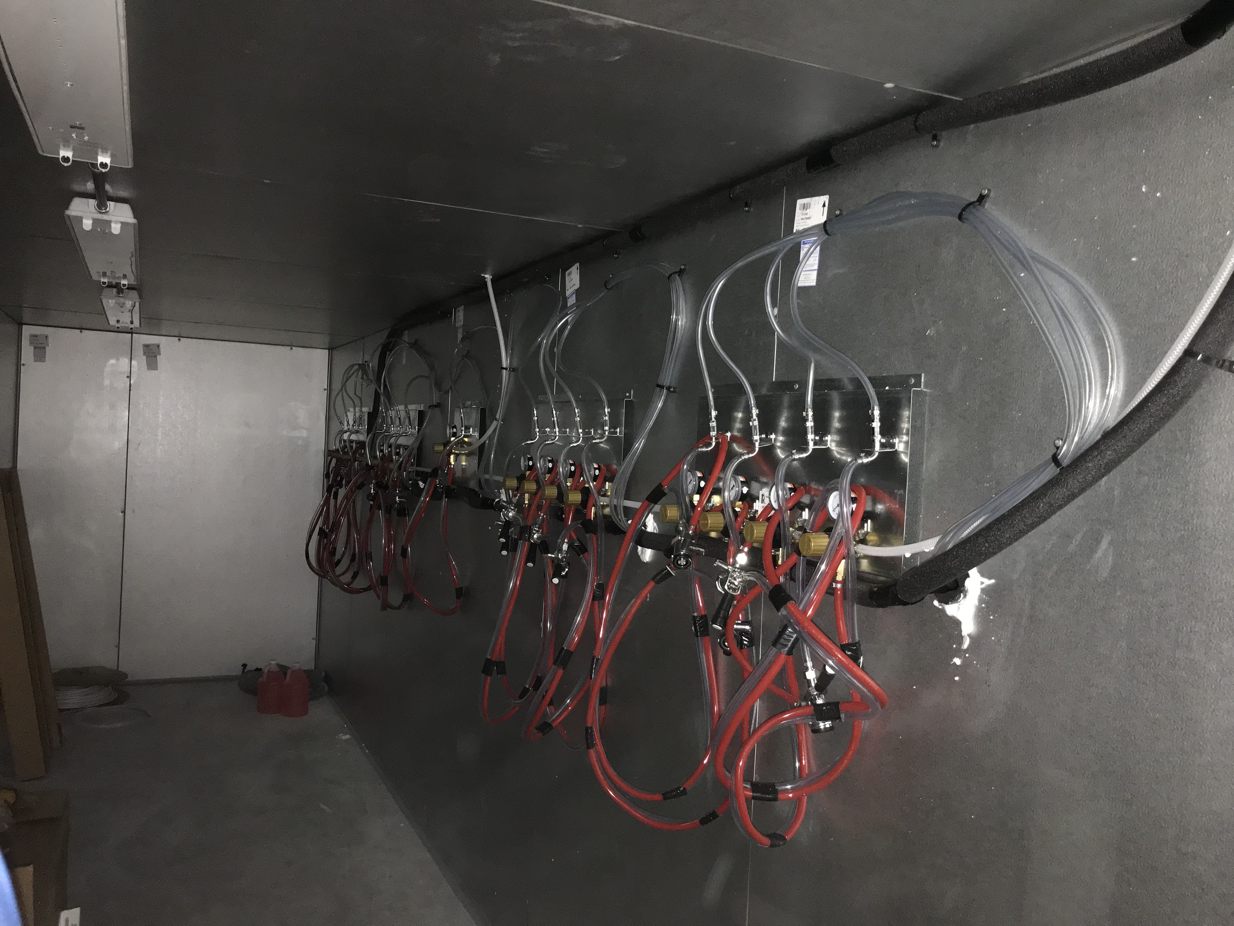 Walk-in cooler with multiple CO2 and beer line manifold setups for state compliance