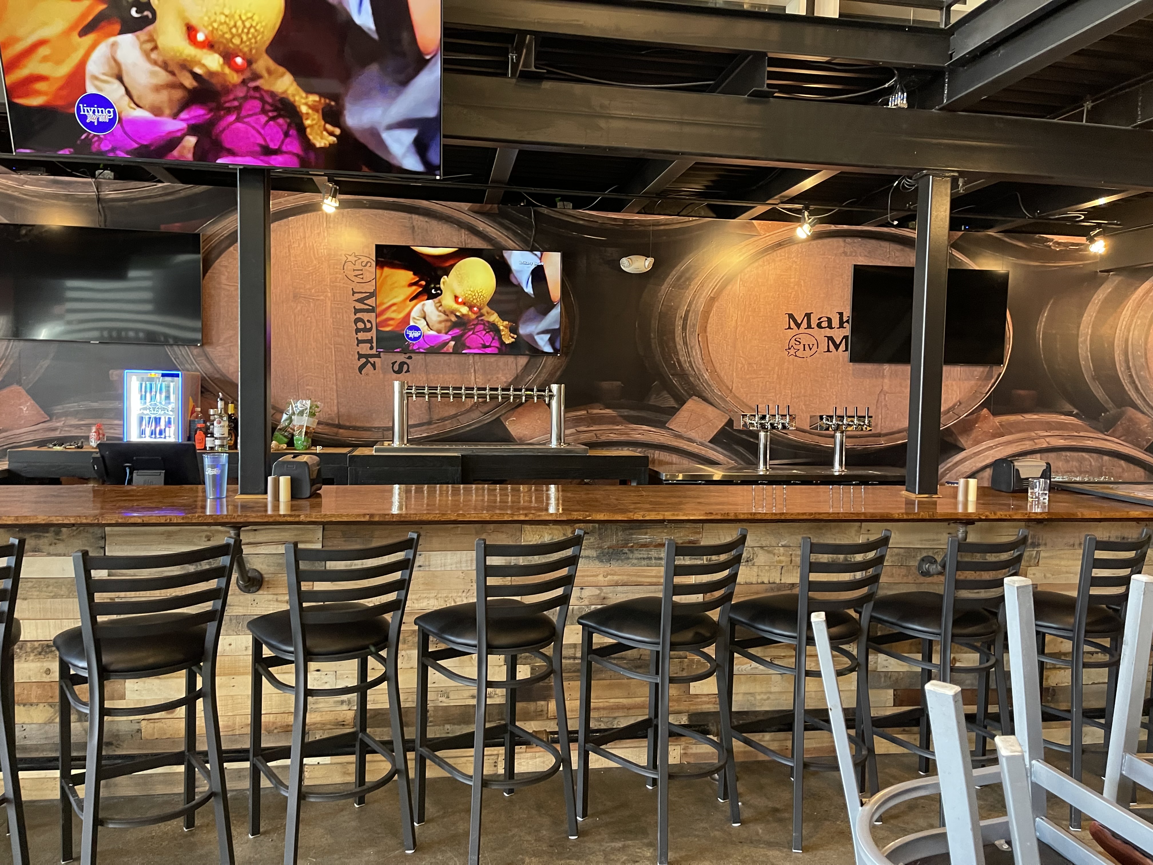 Completed commercial bar with Maker Mark barrel mural and dual pedestal draft towers