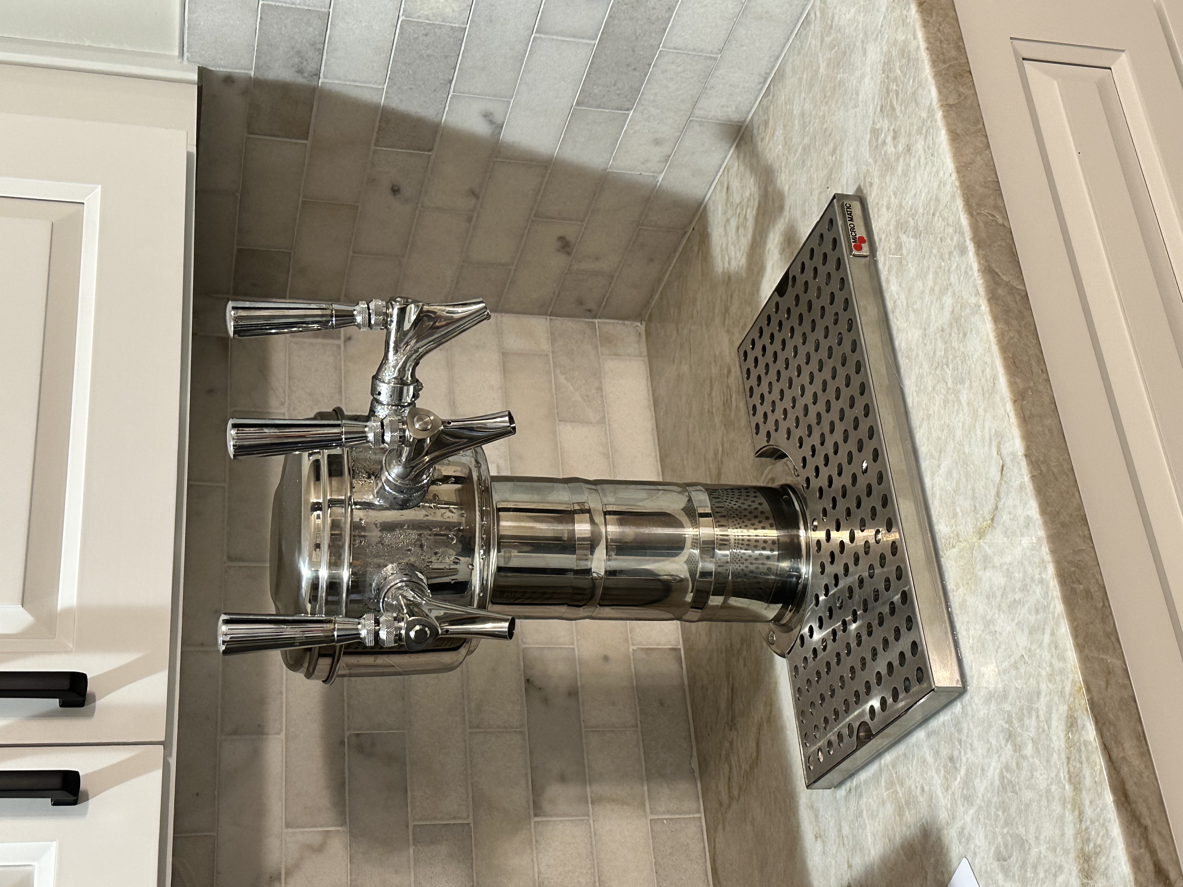 Polished chrome 4-tap tower with drip tray for residential install