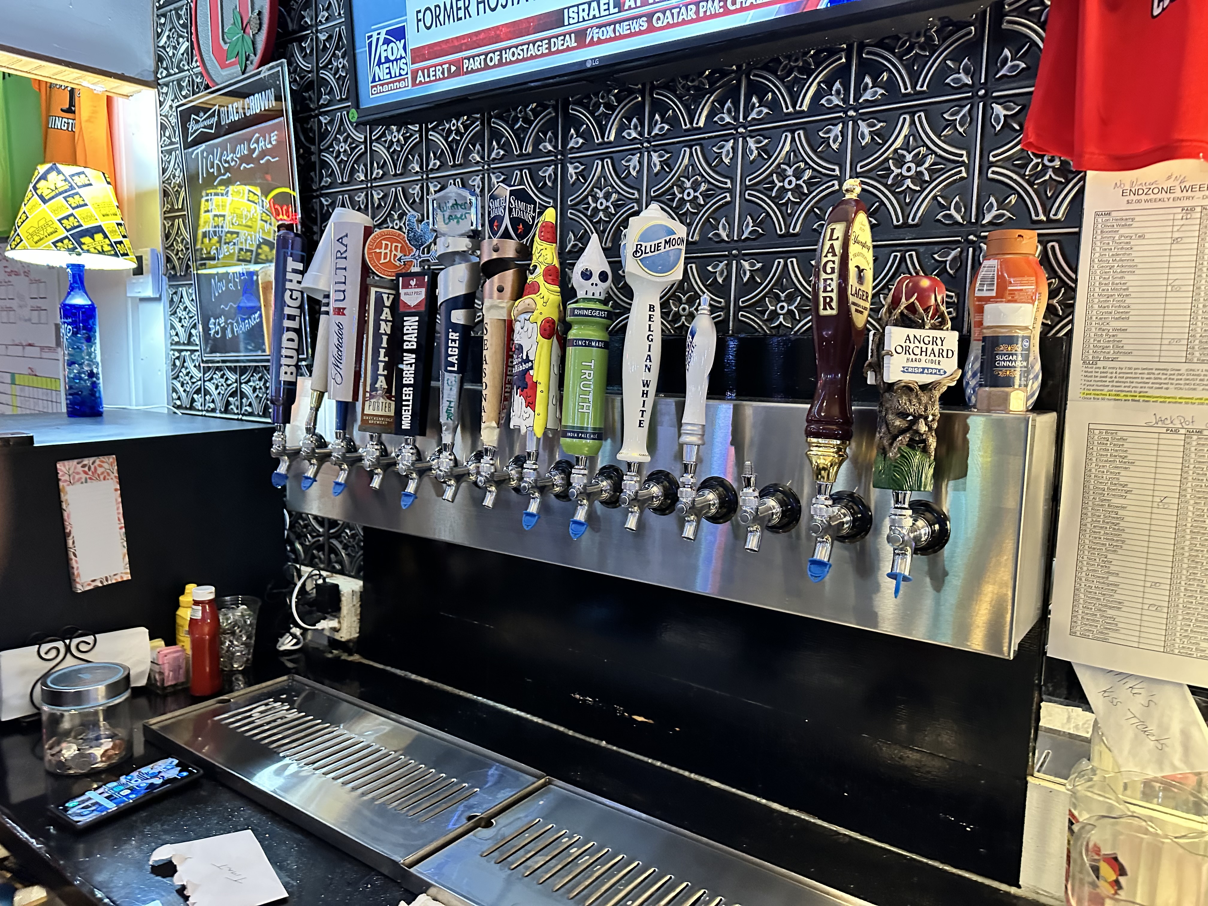 Bar tap setup with Blue Moon, Rhinegeist, and Angry Orchard handles
